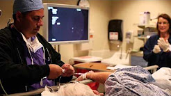 Doctors in surgery doing a colonoscopy